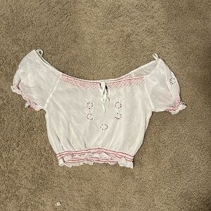 White and red shirt with beaded accents. Brand is speed star, size medium